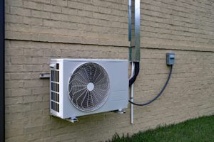 mini split system mounted on an exterior wall