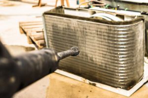air conditioning coils being cleaned by HVAC company